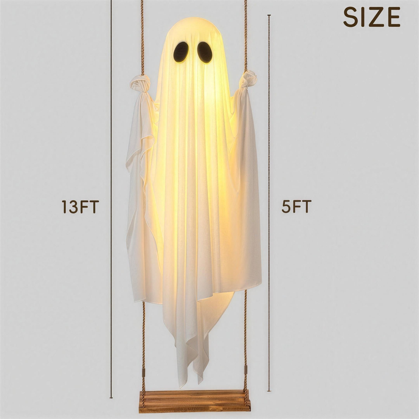 Glowing skeleton ghost decoration hanging outdoors, close-up detail